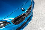 Alpha N F87 M2 Competition CS Carbon Corse front grille installed on the exterior of the car, showcasing sleek carbon fiber design.
