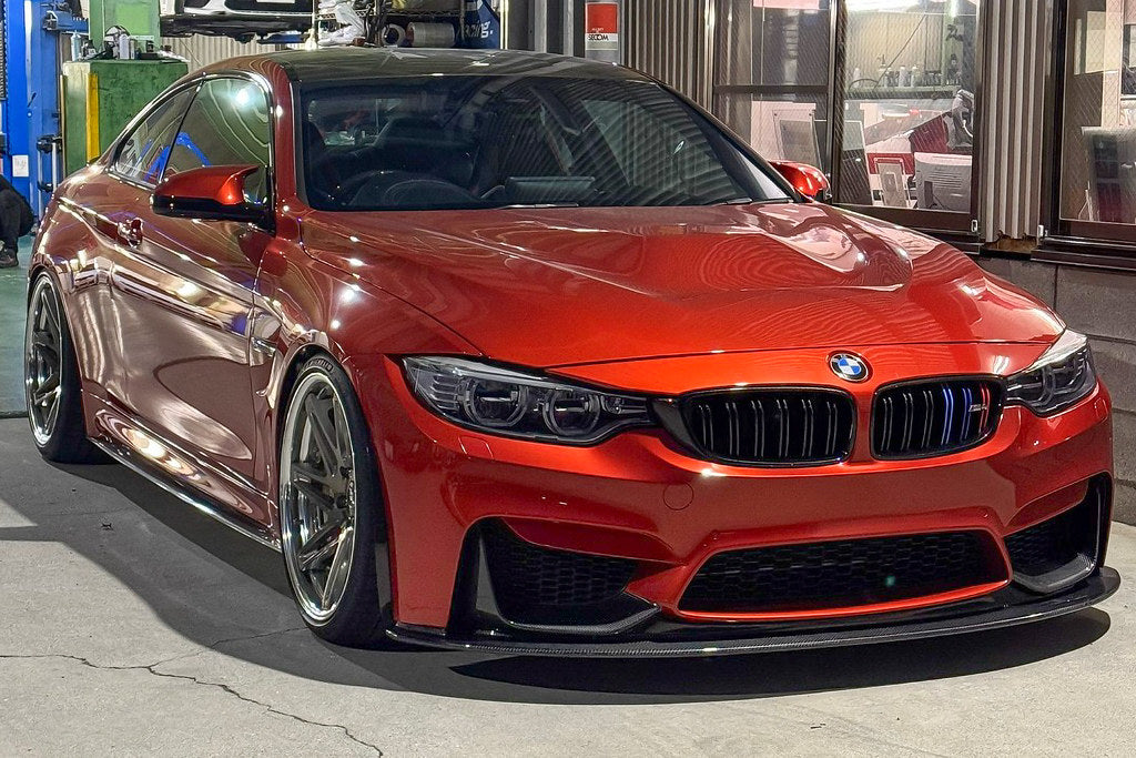 Alpha N F8X M3 M4 Carbon Corse Aeroblades installed on the exterior of the vehicle, showcasing sleek carbon fiber design.