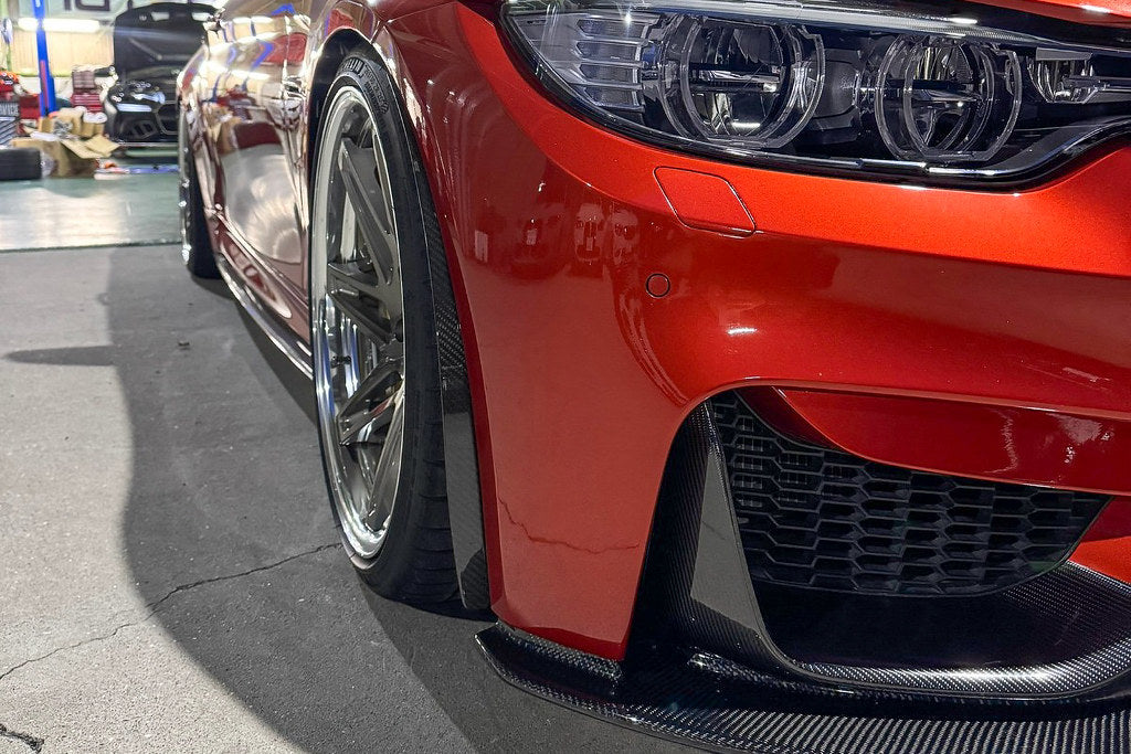 Alpha N F8X M3 M4 Carbon Corse Aeroblades installed on the exterior of the vehicle, showcasing sleek aerodynamic design.