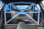 Alpha-N G87 M2 bolt-in harness bar installed in car interior for enhanced safety and seating support.