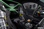 Interior view of Alpha N G87 M2 bolt-in harness bar installed in a vehicle for added safety and support.