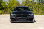 Alpha N G87 M2 carbon adjustable front lip installed on vehicle, showcasing its sleek exterior design and Class 3 style.