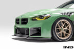 Alpha N G87 M2 carbon adjustable front lip installed on a BMW G87 M2, showcasing its sleek exterior design and aerodynamic features.