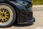 Alpha-N G87 M2 carbon adjustable front lip installed on BMW M2, showcasing its sleek exterior design and Class 3 style.