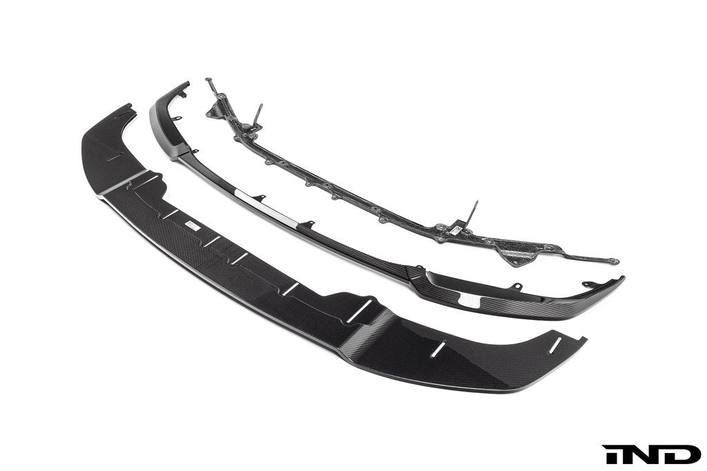 Alpha N G87 M2 Carbon adjustable front lip, Class 3, exterior car accessory with a sleek design on a white background.