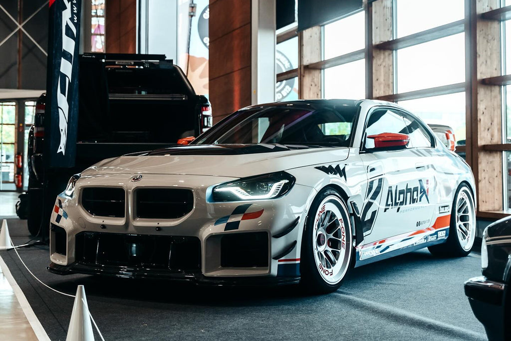 Alpha-N carbon bumper canard set installed on BMW G87 M2 front bumper
