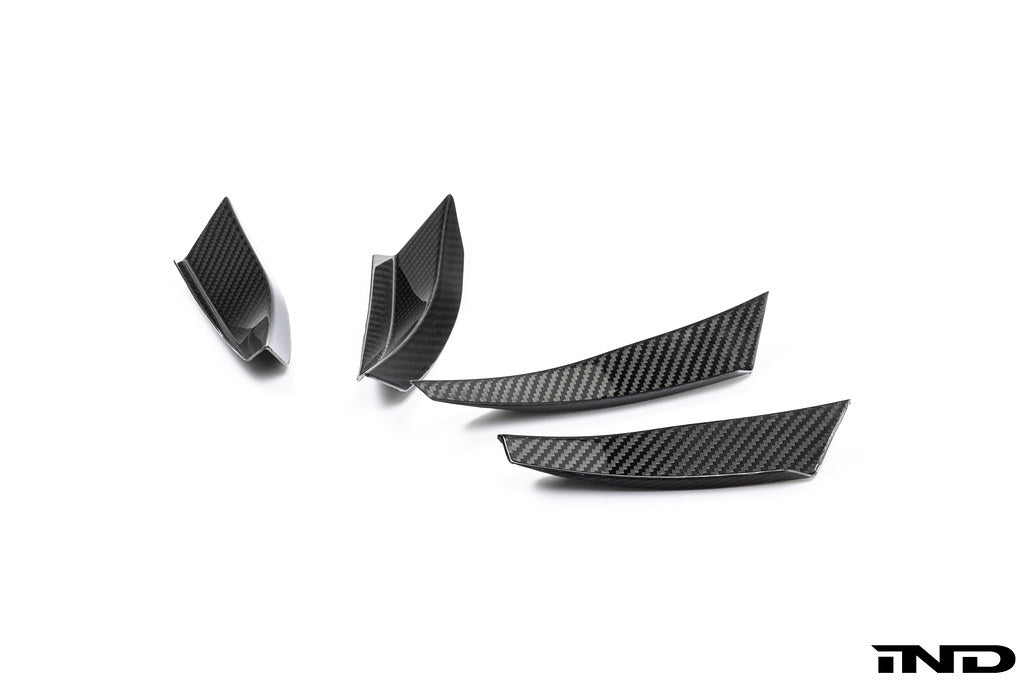 Alpha N G87 M2 carbon bumper canard set mounted on a white background, designed for aerodynamic enhancement of the vehicle's exterior.