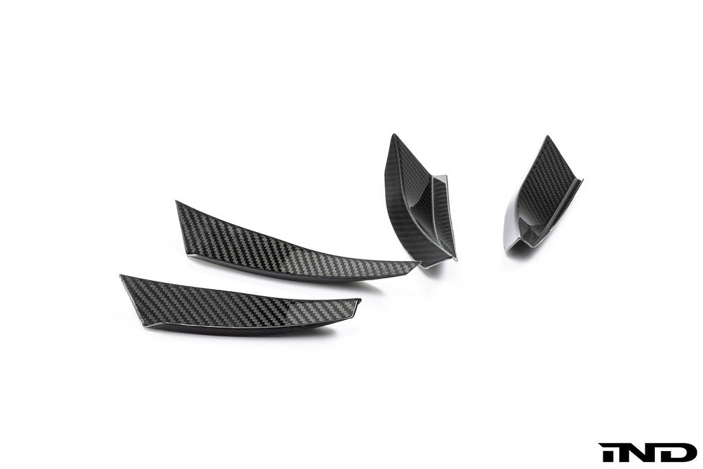 Alpha N G87 M2 carbon bumper canard set mounted on white background, enhancing the car's sporty exterior aerodynamic features.