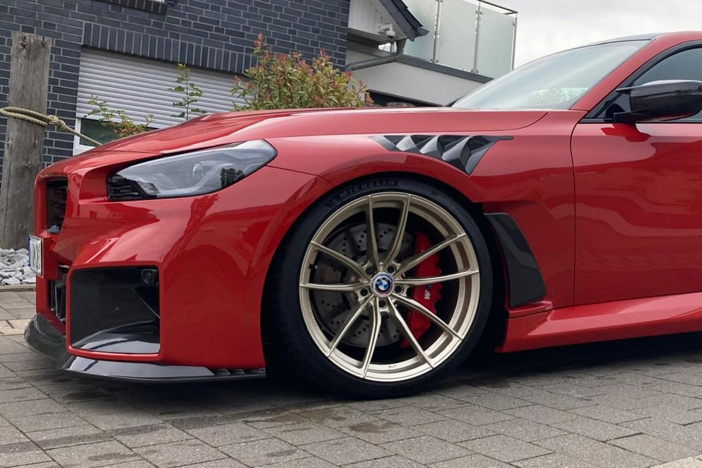 Alpha N G87 M2 Carbon Clubsport front lip installed on the car, showcasing its sleek, aerodynamic exterior enhancement.