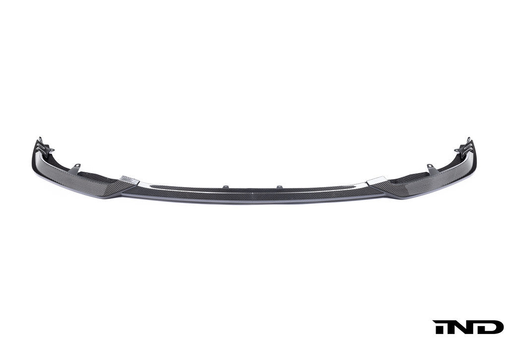White Alpha N G87 M2 Carbon Clubsport front lip exterior car part on a plain background
