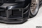 Alpha-N Carbon Corse front splitter installed on a Black Sapphire BMW G87 M2, enhancing the front-end appearance with pre-preg carbon fiber construction and aggressive styling.