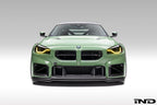 Alpha N G87 M2 carbon front center bumper trim installed on vehicle, showcasing sleek exterior automotive accessory.