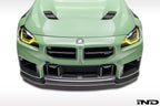 Alpha N G87 M2 carbon front center bumper trim installed on a vehicle's exterior, showcasing sleek, lightweight carbon fiber design.