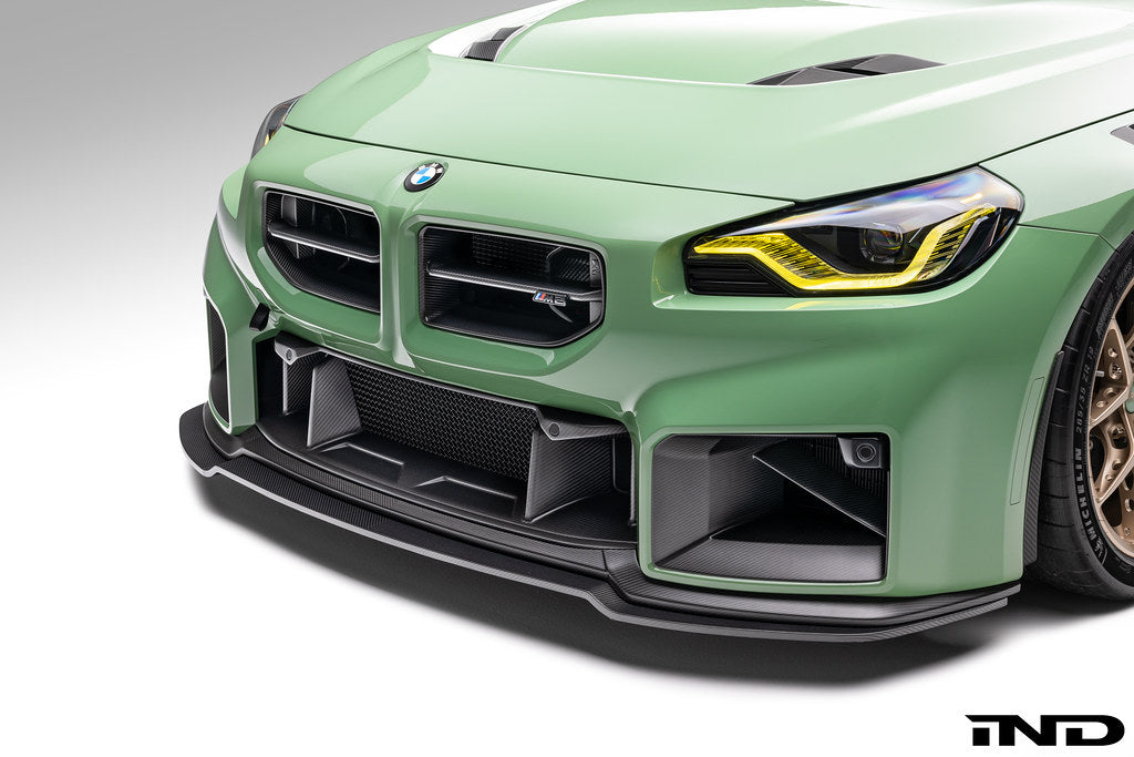 Alpha-N G87 M2 carbon front center bumper trim installed on the exterior of a vehicle, showcasing a sleek, lightweight design.