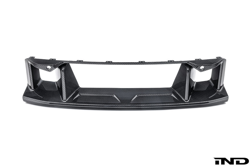 Alpha-N G87 M2 carbon front center bumper trim installed on a vehicle, showcasing sleek exterior design and high-quality material.