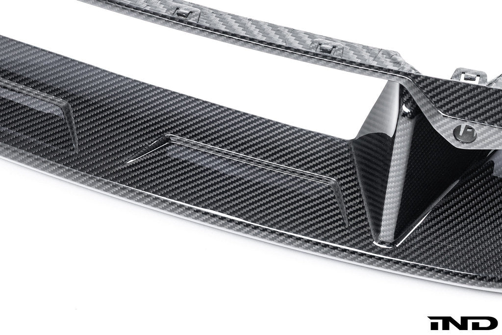 Alpha-N G87 M2 carbon front center bumper trim, exterior accessory with a sleek design, shown on a white background.