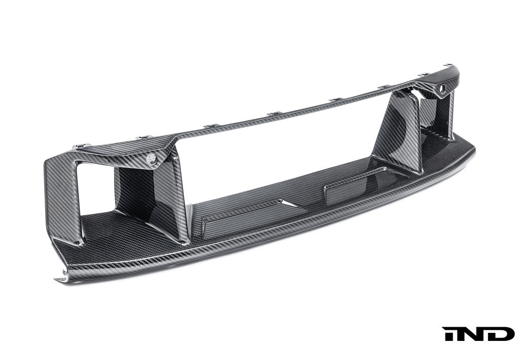 Alpha-N G87 M2 carbon front center bumper trim displayed on a white background, showcasing sleek exterior design and craftsmanship.