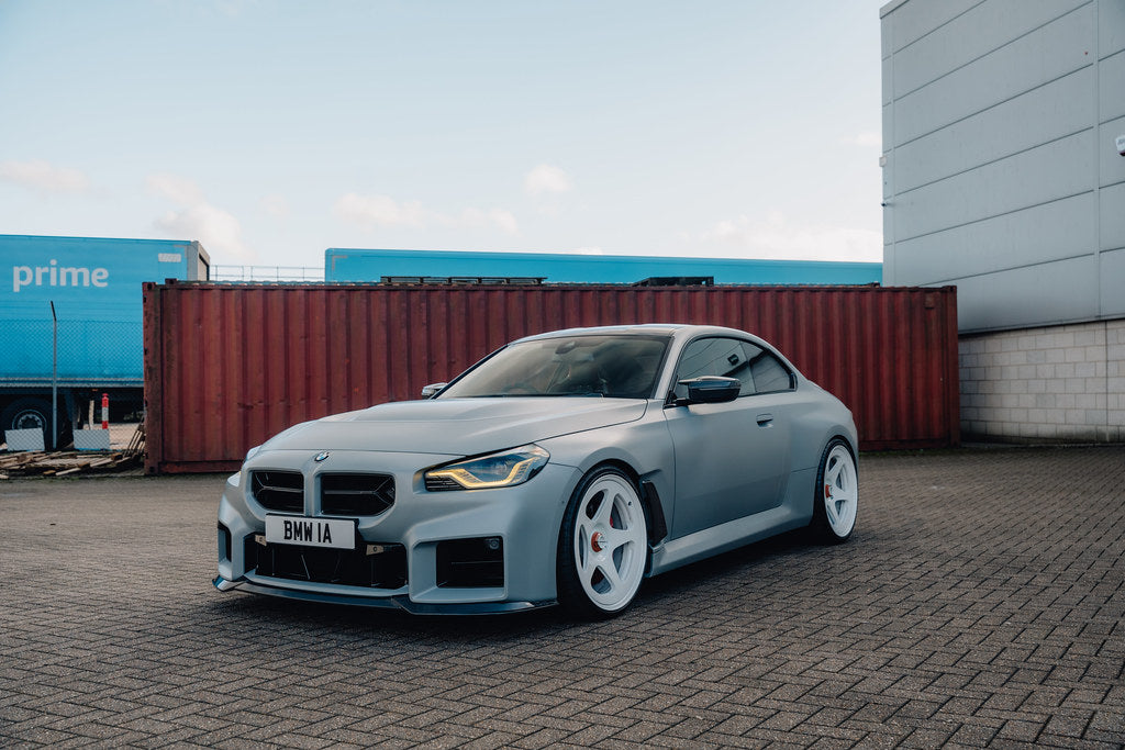 Alpha N G87 M2 carbon front fender set V2 with blades installed on a BMW M2 exterior car.