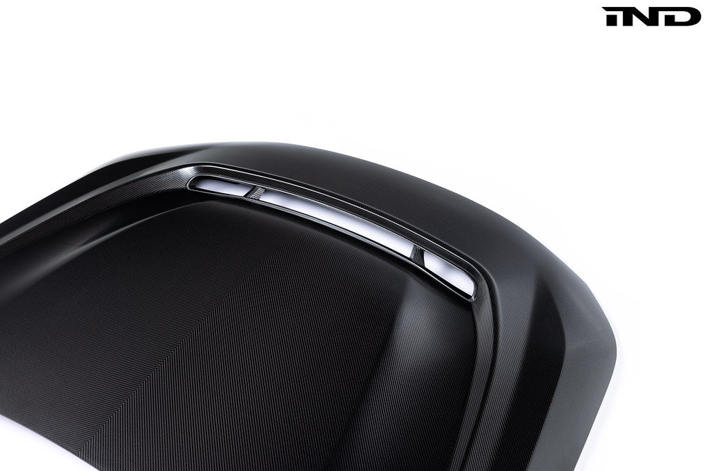 Alpha-N G87 M2 carbon vented hood with front vent insert on white background, showcasing its sleek exterior design.