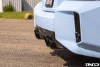 Alpha-N G87 M2 carbon rear diffuser installed on a BMW M2 G87, showcasing sleek aerodynamic exterior upgrade.