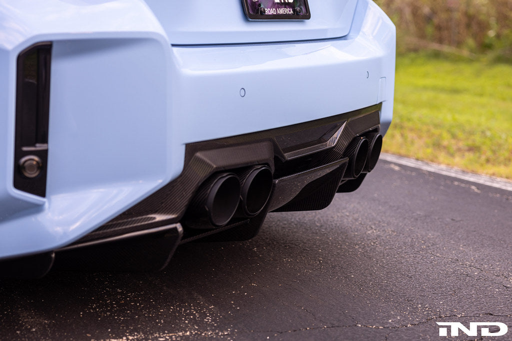 Alpha N G87 M2 carbon rear diffuser installed on a BMW M2 G87, showcasing its sleek, aerodynamic exterior design.