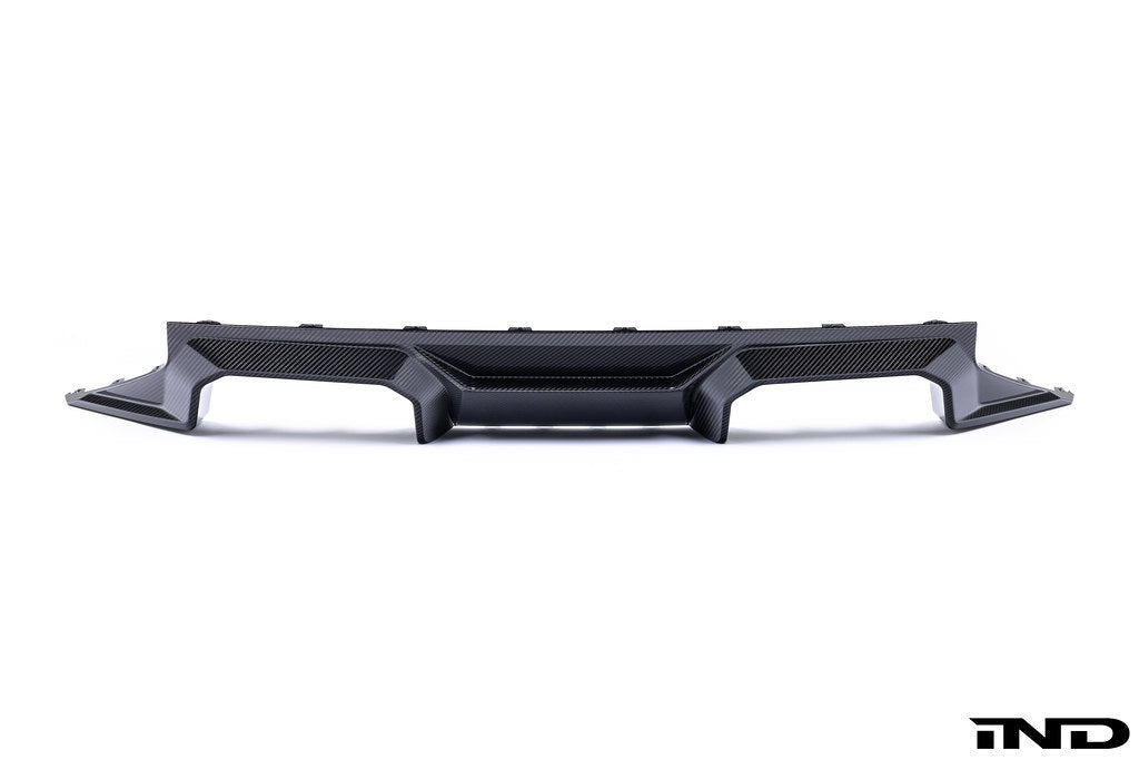 Alpha-N G87 M2 carbon rear diffuser mounted on a white background, showcasing its aerodynamic design and lightweight carbon fiber material.
