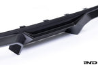 Alpha N G87 M2 carbon rear diffuser installed on car, showcasing sleek exterior design on a white background.