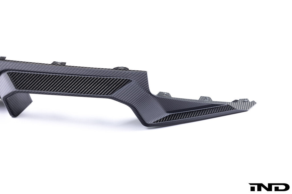 Alpha N G87 M2 carbon rear diffuser mounted on a white background, showcasing its aerodynamic design and high-quality carbon fiber finish.