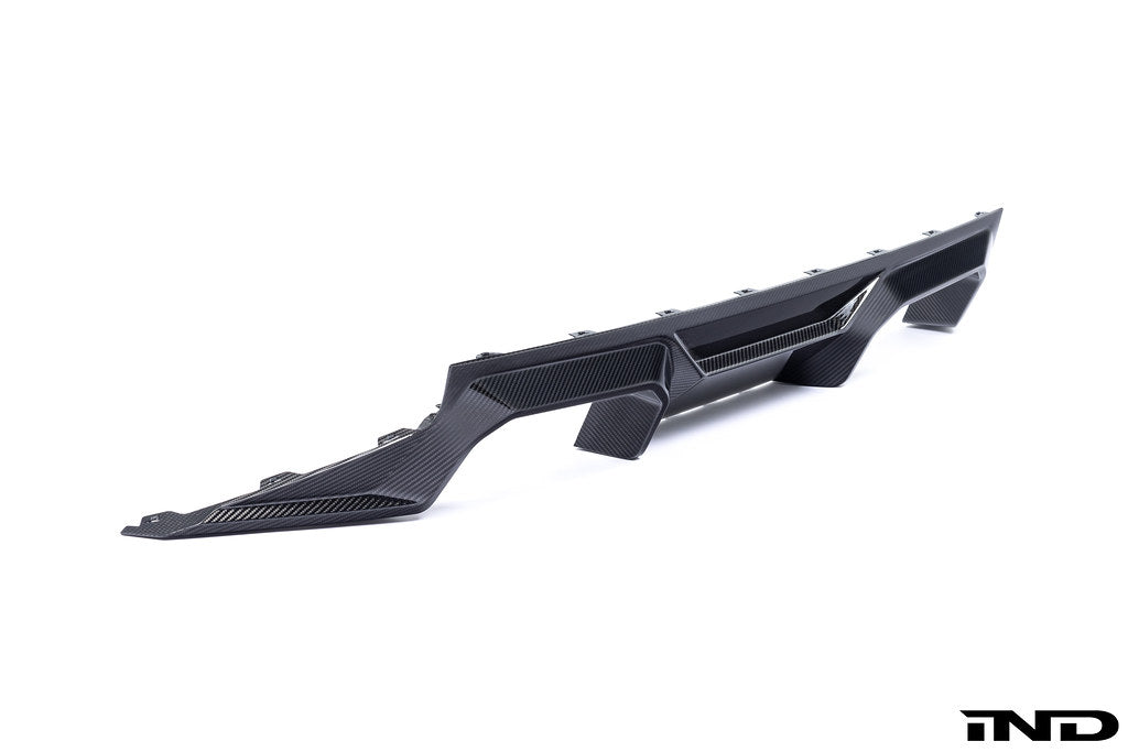 Alpha N G87 M2 carbon rear diffuser mounted on a white background, showcasing its sleek aerodynamic design for BMW M2.