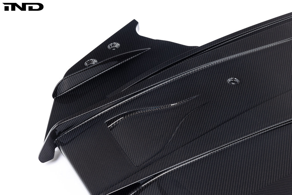 Alpha N G87 M2 carbon rear underbody floor kit shown on white background, highlighting lightweight aerodynamic design.