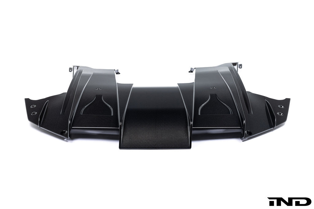 Alpha N G87 M2 carbon rear underbody floor kit installed on a white background, showcasing its sleek aerodynamic design.
