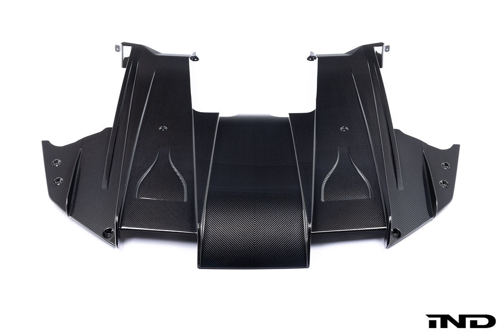 Alpha N G87 M2 carbon rear underbody floor kit installed on a white background, showcasing its lightweight aerodynamic design.