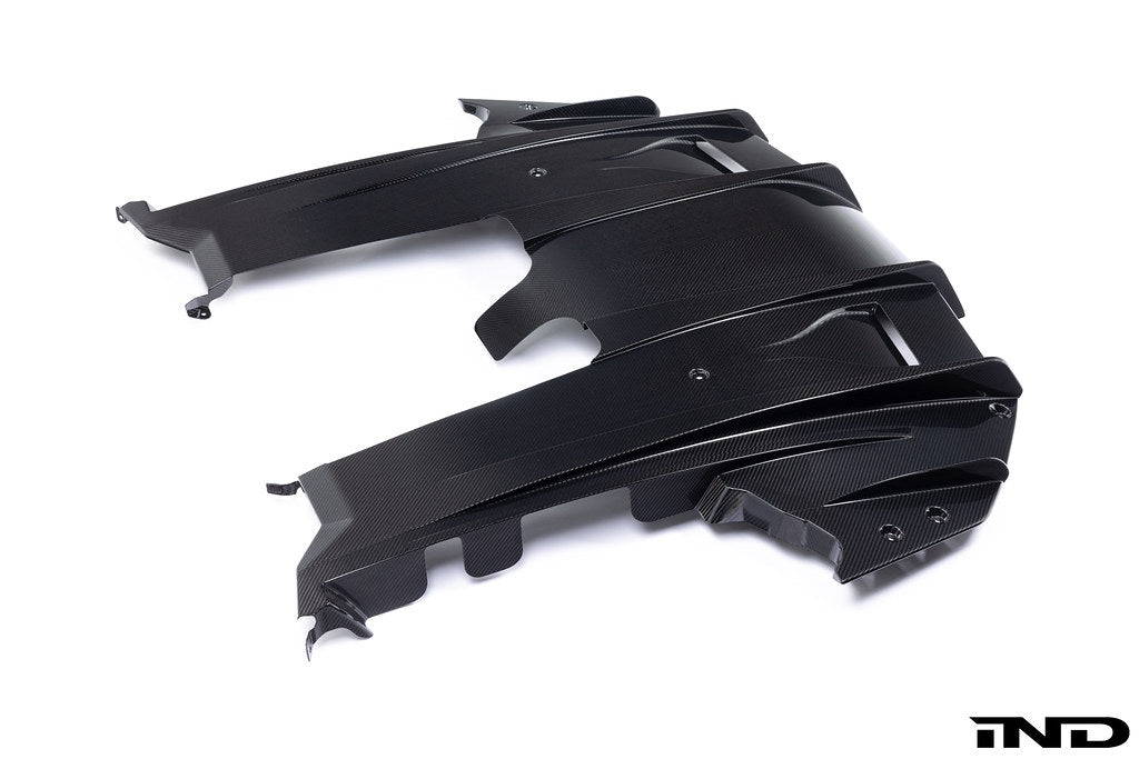 Alpha N G87 M2 carbon rear underbody floor kit installed on a car, shown against a white background, highlighting its sleek design.