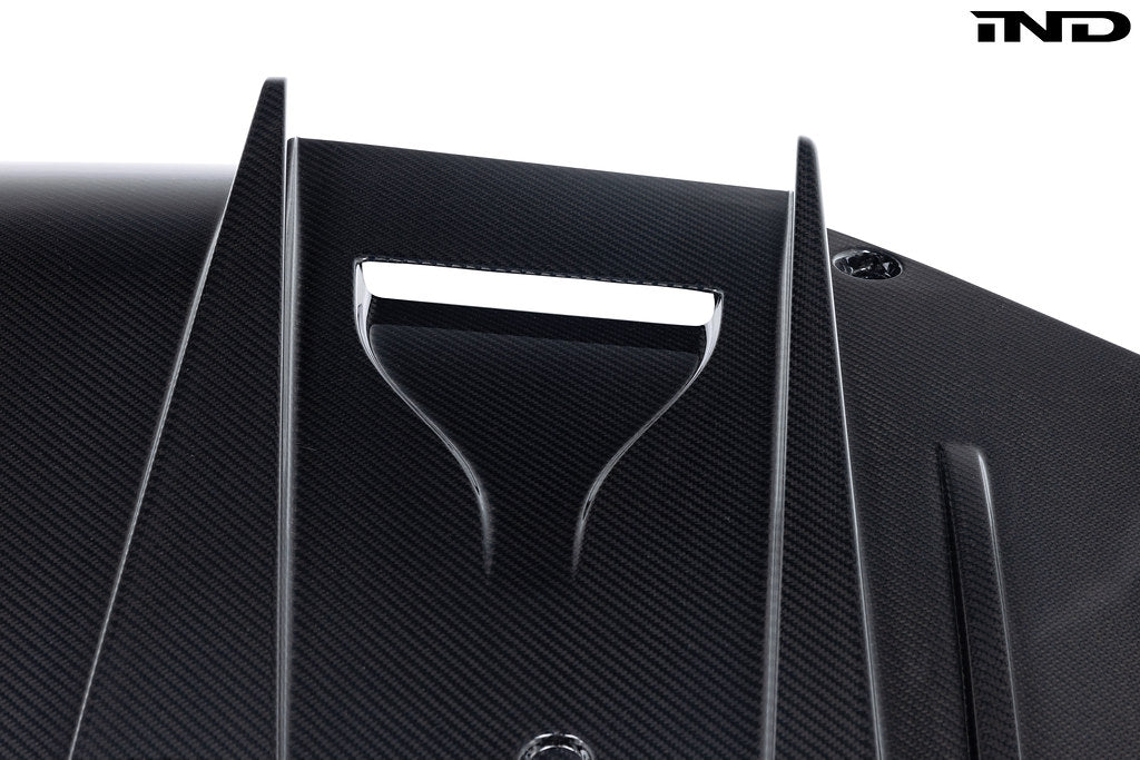 Alpha N G87 M2 carbon rear underbody floor kit installed on a BMW M2, showcasing lightweight aerodynamic exterior upgrade.