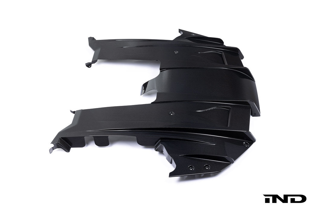 Alpha N G87 M2 carbon rear underbody floor kit installed on a white background, showcasing its aerodynamic design and lightweight construction.