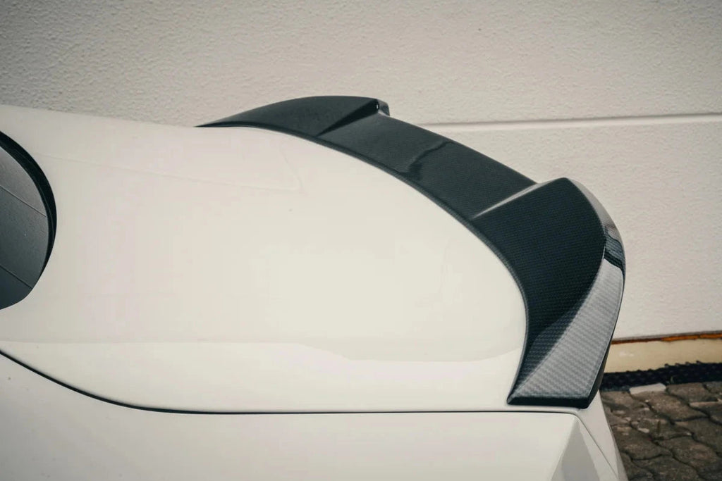 Alpha N G87 M2 carbon trunk spoiler installed on the exterior of the car, showcasing its sleek, aerodynamic design.