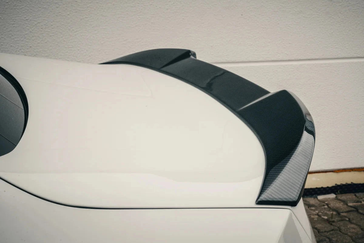 Alpha N G87 M2 carbon trunk spoiler installed on the exterior of the car, showcasing its sleek, aerodynamic design.