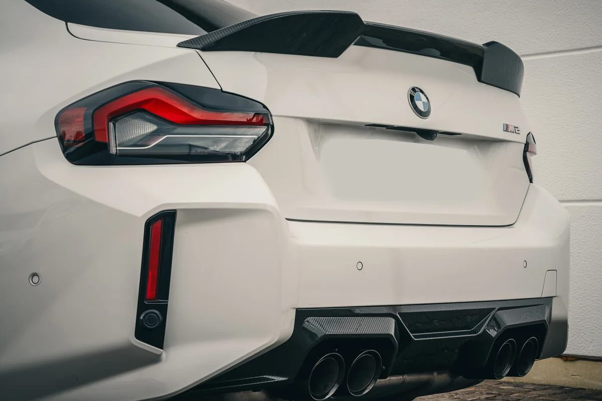 Alpha-N G87 M2 carbon trunk spoiler installed on a BMW, showcasing its sleek, aerodynamic exterior design.