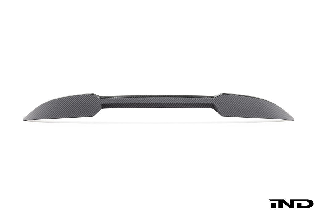 Alpha-N G87 M2 carbon trunk spoiler installed on a white background, showcasing its sleek exterior design and lightweight carbon material.