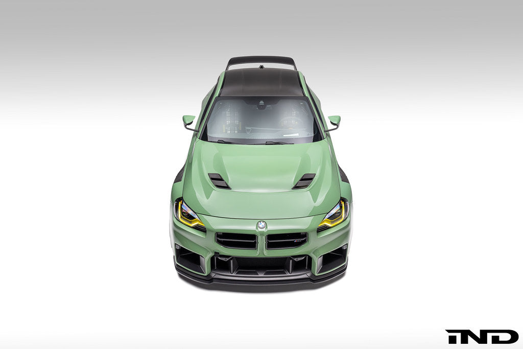 Alpha-N G87 M2 Carbon Vented Hood installed on a car, showcasing its lightweight, vented design and sleek carbon fiber finish.