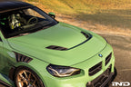 Alpha-N G87 M2 Carbon Vented Hood installed on a car, showing its sleek vented design and lightweight carbon construction.