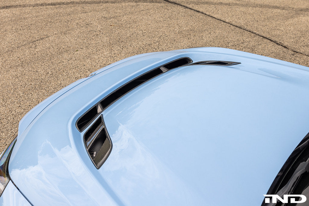 Alpha-N G87 M2 Carbon Vented Hood installed on a BMW M2 Clubsport, showcasing lightweight performance and sleek design.