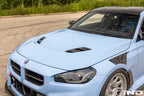 Alpha-N G87 M2 Carbon Vented Hood installed on a vehicle, showcasing the lightweight, vented exterior design for improved airflow.