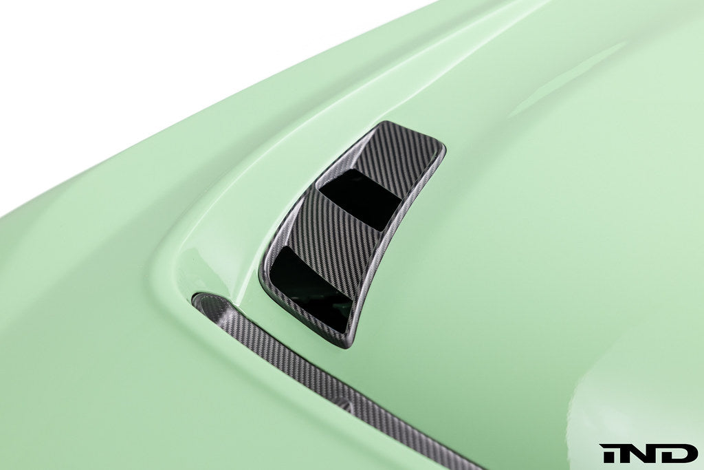 Alpha-N G87 M2 Carbon Vented Hood installed on a car, showcasing its lightweight carbon fiber design and vented airflow system.