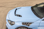 Alpha-N G87 M2 Clubsport carbon vented hood installed on a car, showcasing lightweight, aerodynamic exterior upgrade.