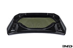 White Alpha N G87 M2 carbon vented hood shown on a white background, highlighting its lightweight, vented exterior design.