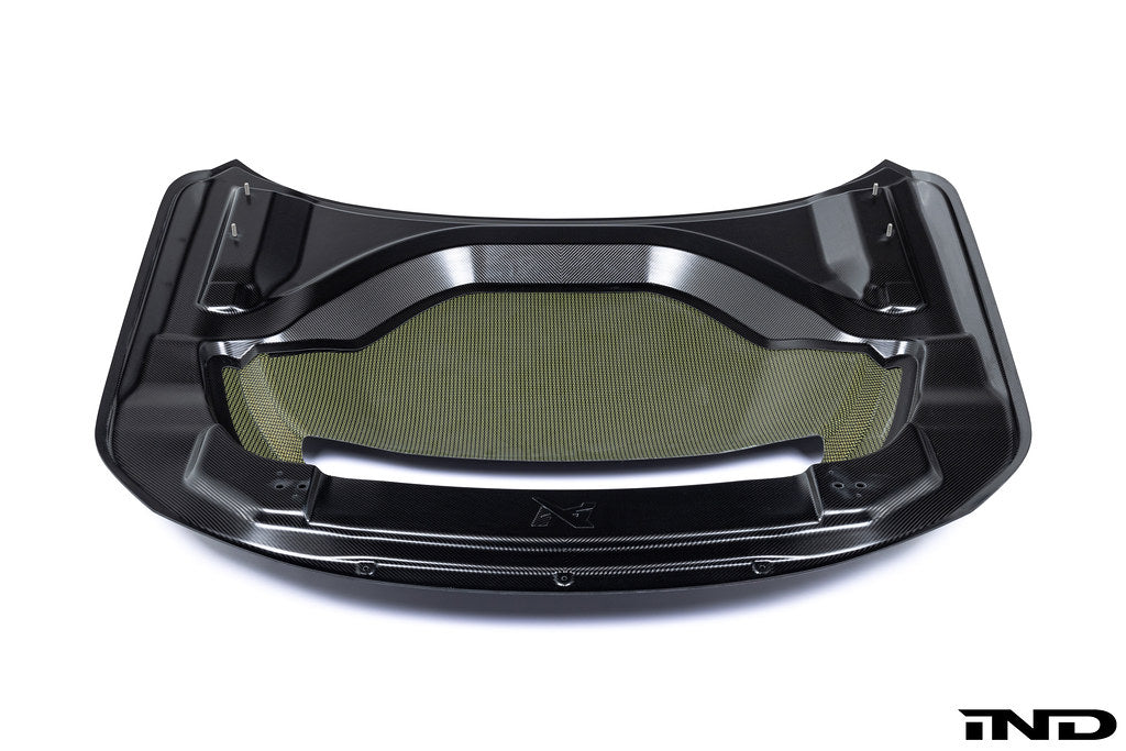 Alpha-N G87 M2 Carbon vented hood installed on a vehicle, showcasing lightweight, aerodynamic exterior design against a white background.