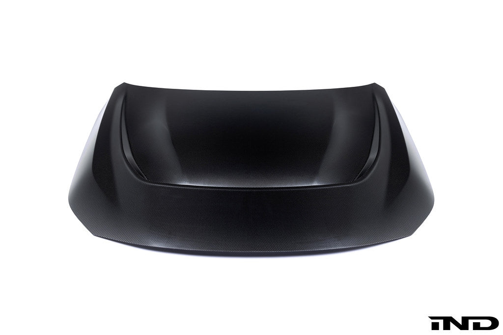 Alpha N G87 M2 carbon vented hood shown on white background, showcasing lightweight, aerodynamic exterior car hood design.