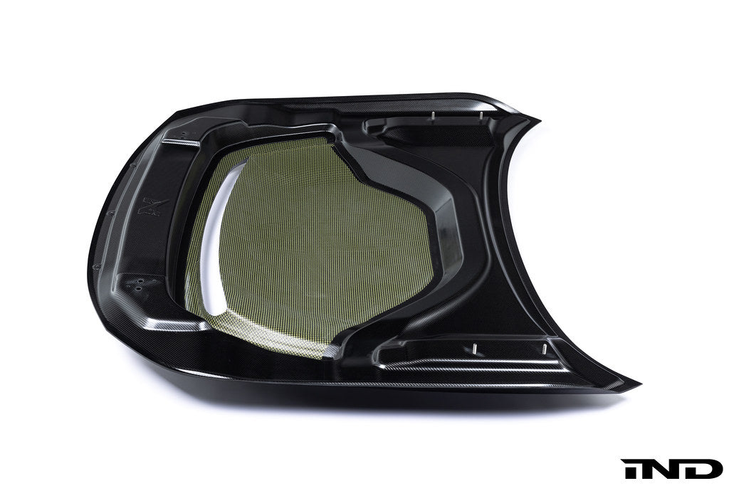 Alpha-N G87 M2 carbon vented hood installed on a vehicle with a white background, showcasing its lightweight, aerodynamic design.