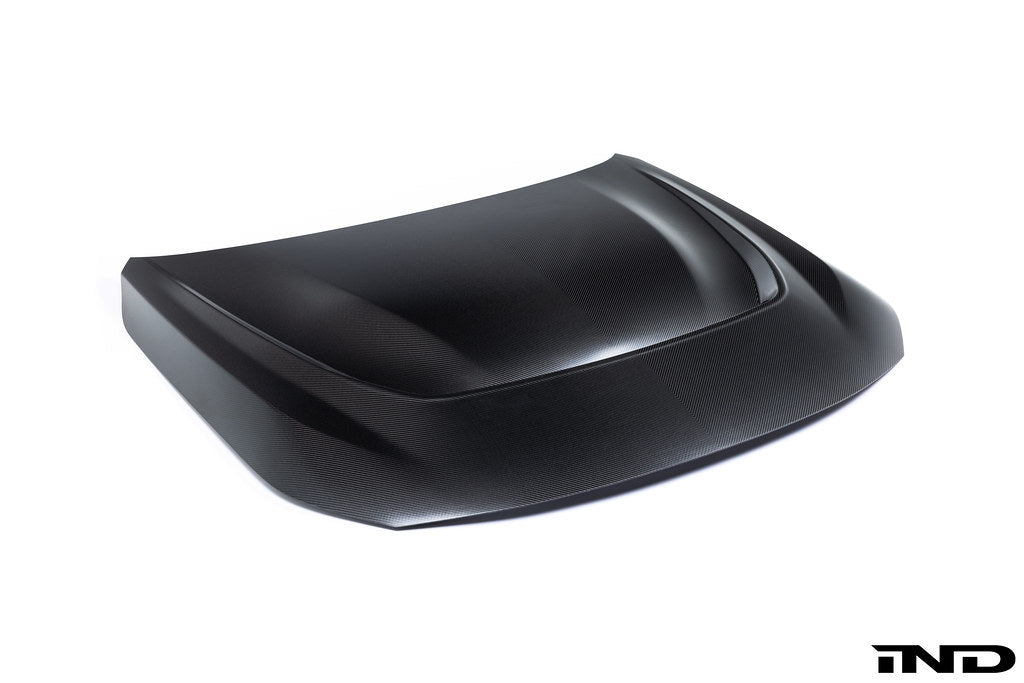 Alpha N G87 M2 carbon vented hood installed on a vehicle, showcasing lightweight design and ventilation features.
